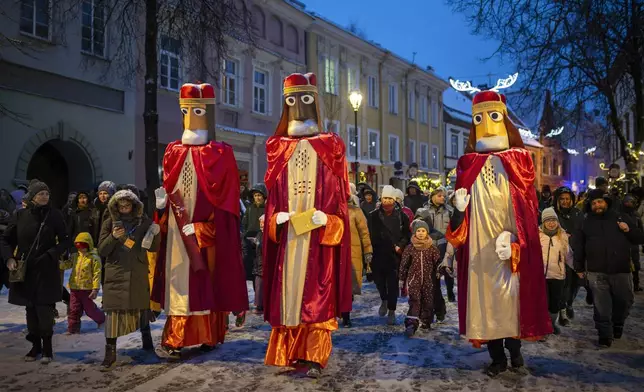 Lithuanians dressed as the Three Kings parade during the Epiphany Day celebrations in Vilnius, Lithuania, Monday, Jan. 6, 2025. (AP Photo/Mindaugas Kulbis)