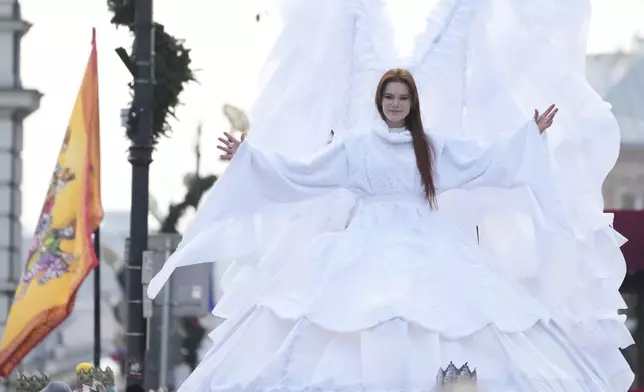 A performer smiles during the annual Epiphany procession in Warsaw, Poland, Monday, Jan. 6, 2025. (AP Photo/Czarek Sokolowski)