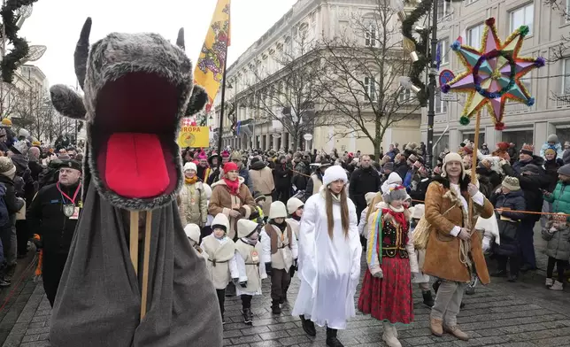 People take part in the annual Epiphany procession in Warsaw, Poland, Monday, Jan. 6, 2025. (AP Photo/Czarek Sokolowski)