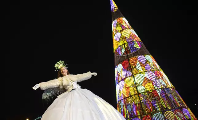 A dancer performs during the traditional "Cabalgata de Reyes" parade in Madrid, Spain, Sunday, Jan. 5, 2025, as part of the festivities marking the Catholic feast of Epiphany. (AP Photo/Bernat Armangue)