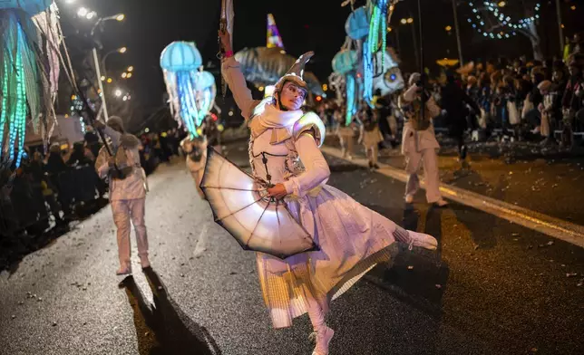 A dancer performs during the traditional "Cabalgata de Reyes" parade in Madrid, Spain, Sunday, Jan. 5, 2025, as part of the festivities marking the Catholic feast of Epiphany. (AP Photo/Bernat Armangue)