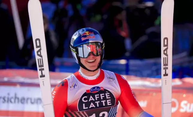 Switzerland's Franjo von Allmen celebrates at the finish area of an alpine ski, men's World Cup downhill, in Wengen, Switzerland, Saturday, Jan. 18, 2025 (AP Photo/Giovanni Maria Pizzato)