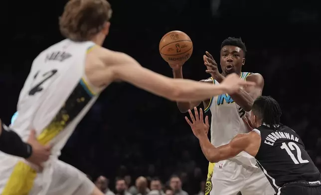 Indiana Pacers' Thomas Bryant (3) passes to Johnny Furphy (12) during the second half of an NBA basketball game against the Brooklyn Nets, Monday, Jan. 6, 2025, in New York. (AP Photo/Frank Franklin II)