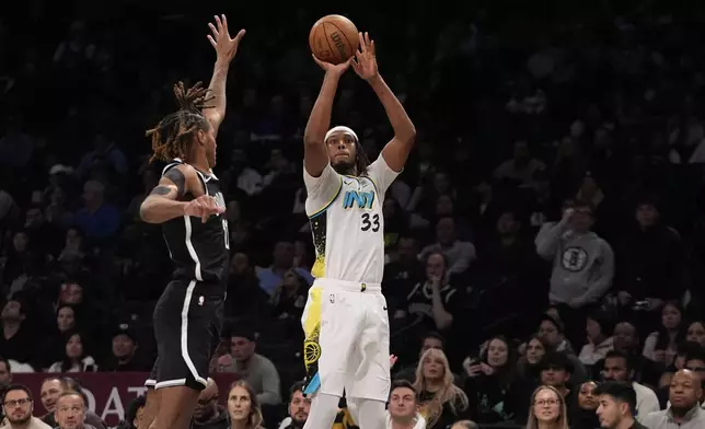 Indiana Pacers' Myles Turner (33) shoots over Brooklyn Nets' Noah Clowney (21) during the second half of an NBA basketball game, Monday, Jan. 6, 2025, in New York. (AP Photo/Frank Franklin II)