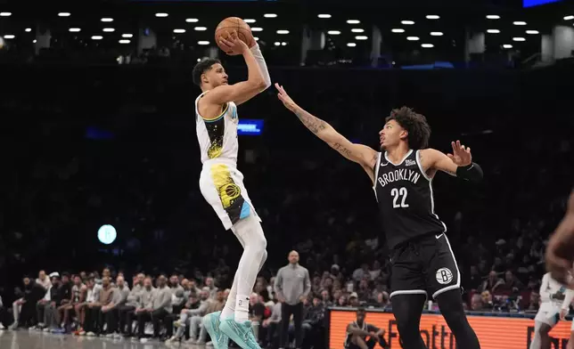 Indiana Pacers' Tyrese Haliburton, left, shoots over Brooklyn Nets' Jalen Wilson (22) during the second half of an NBA basketball game, Monday, Jan. 6, 2025, in New York. (AP Photo/Frank Franklin II)