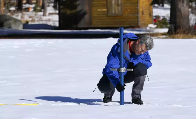 From the California Department of Water Resources, Andy Reising the Manager of the Snow Survey and Water Supply Forecasting Unit conducts the first snow survey of the season to assess how much water the state might have come spring and summer at Phillips Station on Thursday, Jan. 2, 2025. (AP Photo/Brooke Hess-Homeier)