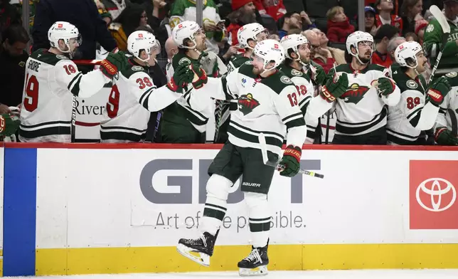 Minnesota Wild center Yakov Trenin (13) celebrates his goal during the first period of an NHL hockey game against the Washington Capitals, Thursday, Jan. 2, 2025, in Washington. (AP Photo/Nick Wass)