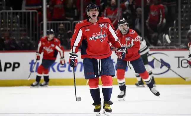 Washington Capitals left wing Alex Ovechkin (8) celebrates his goal during the second period of an NHL hockey game against the Minnesota Wild, Thursday, Jan. 2, 2025, in Washington. (AP Photo/Nick Wass)