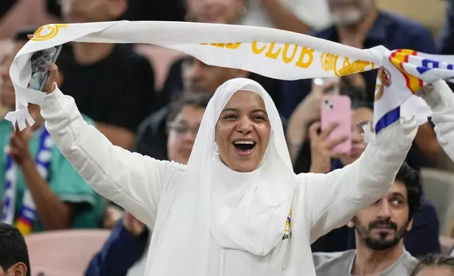 A supporter cheers before the Spanish Super Cup semifinal soccer match between Real Madrid and Mallorca at the King Abdullah Stadium in Jeddah, Saudi Arabia, Thursday, Jan. 9, 2025. (AP Photo/Altaf Qadri)