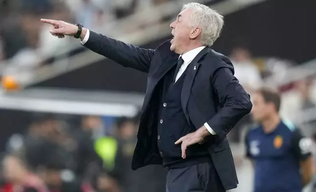 Real Madrid's head coach Carlo Ancelotti gestures during the Spanish Super Cup semifinal soccer match between Real Madrid and Mallorca at the King Abdullah Stadium in Jeddah, Saudi Arabia, Thursday, Jan. 9, 2025. (AP Photo/Altaf Qadri)