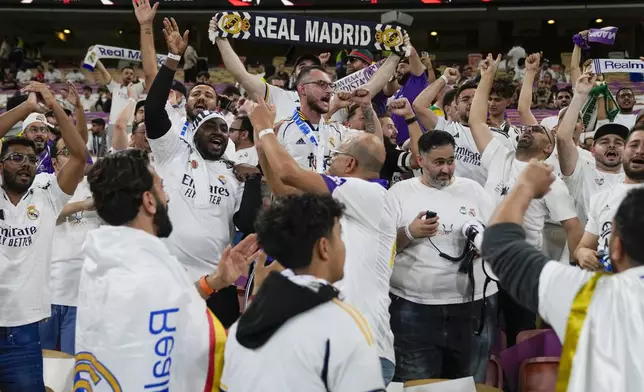 Supporters cheer ahead of the Spanish Super Cup semifinal soccer match between Real Madrid and Mallorca at the King Abdullah Stadium in Jeddah, Saudi Arabia, Thursday, Jan. 9, 2025. (AP Photo/Altaf Qadri)