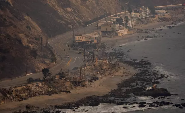 Beach front properties are left destroyed by the Palisades Fire, in this aerial view, Thursday, Jan. 9, 2025 in Malibu, Calif. (AP Photo/Mark J. Terrill)