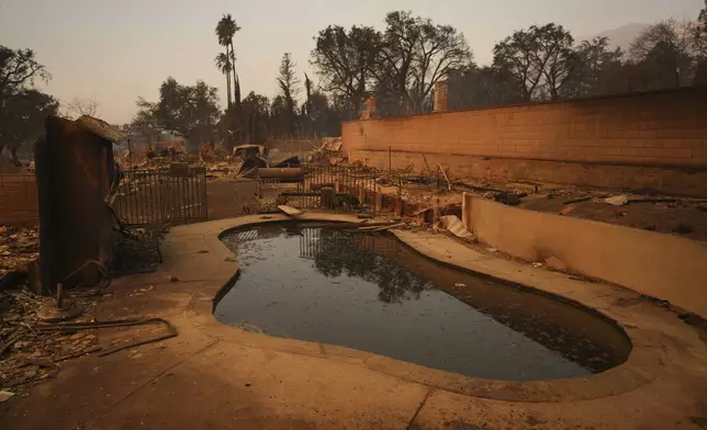 A fire ravaged property is seen in the aftermath of the Eaton Fire Thursday, Jan. 9, 2025 in Altadena, Calif. (AP Photo/Eric Thayer)