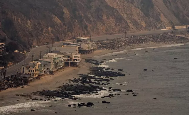 Beach front properties are left destroyed by the Palisades Fire, in this aerial view, Thursday, Jan. 9, 2025 in Malibu, Calif. (AP Photo/Mark J. Terrill)