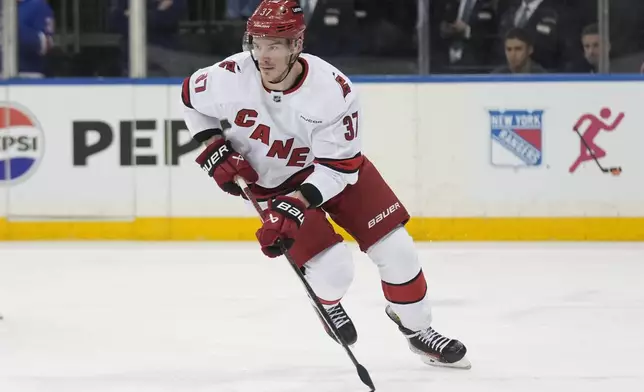 Carolina Hurricanes' Andrei Svechnikov moves the puck up the ice during the second period of an NHL hockey game against the New York Rangers, Tuesday, Jan. 28, 2025, in New York. (AP Photo/Seth Wenig)