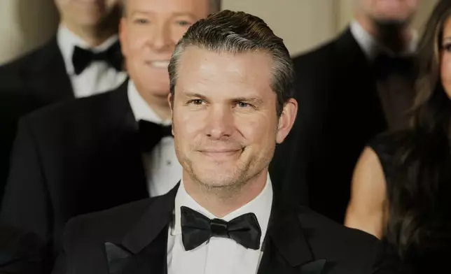 Pete Hegseth, President-elect Donald Trump's choice to be Defense Secretary, poses for a photo with Cabinet picks, other nominees and appointments, at the National Gallery of Art in Washington, Saturday, Jan. 18, 2025. (AP Photo/Mark Schiefelbein)
