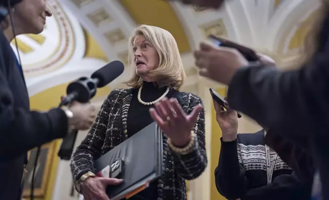 Sen. Lisa Murkowski, R-Alaska, speaks with reporters outside the Senate chamber at the Capitol in Washington, Wednesday, Jan. 22, 2025. (AP Photo/J. Scott Applewhite)