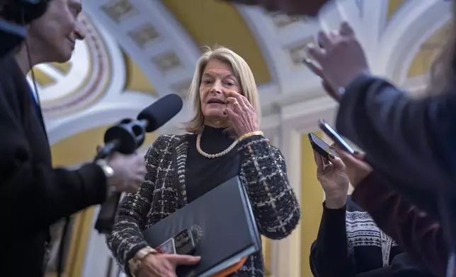 Sen. Lisa Murkowski, R-Alaska, speaks with reporters outside the Senate chamber at the Capitol in Washington, Wednesday, Jan. 22, 2025. (AP Photo/J. Scott Applewhite)