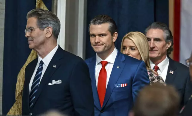 Defense Secretary nominee Pete Hegseth, from second left, Attorney General nominee Pam Bondi and Secretary of the Interior nominee former North Dakota Gov. Doug Burgum, arrive before the 60th Presidential Inauguration in the Rotunda of the U.S. Capitol in Washington, Monday, Jan. 20, 2025. (Kenny Holston/The New York Times via AP, Pool)