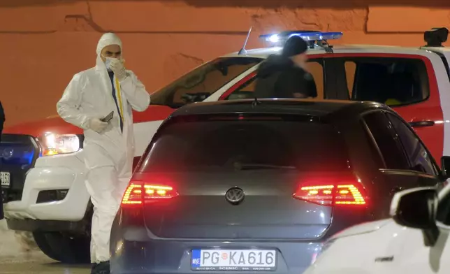 Police investigators work at the site of a shooting in Cetinje, 36 kilometers (22 miles) west of Podogrica, Montenegro, Wednesday, Jan 1, 2025. (AP Photo/Risto Bozovic)