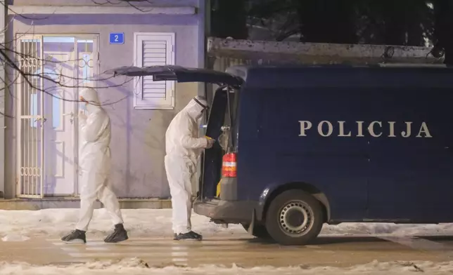 Police investigators work at the site of a shooting in Cetinje, 36 kilometers (22 miles) west of Podogrica, Montenegro, Wednesday, Jan 1, 2025. (AP Photo/Risto Bozovic)