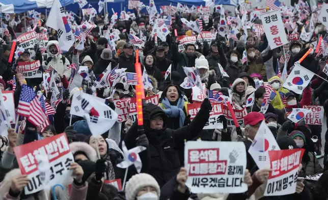 Supporters of impeached South Korean President Yoon Suk Yeol attend a rally to oppose his impeachment near the presidential residence in Seoul, South Korea, Monday, Jan. 6, 2025. (AP Photo/Ahn Young-joon)