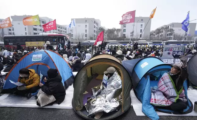 Protesters demanding the arrest of impeached South Korean President Yoon Suk Yeol attend a rally near the presidential residence in Seoul, South Korea, Monday, Jan. 6, 2025. (AP Photo/Ahn Young-joon)