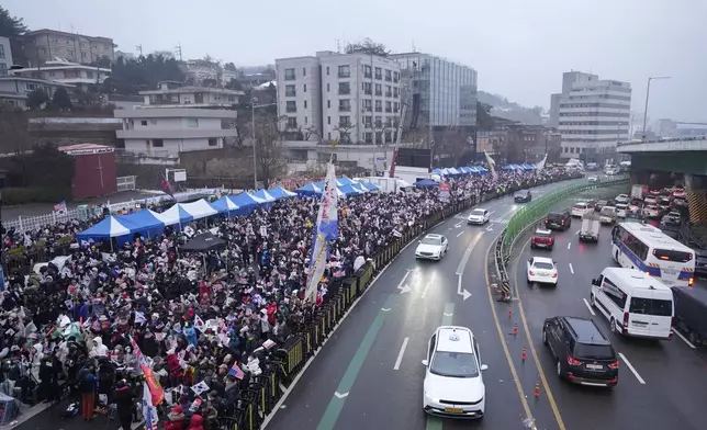 Supporters of impeached South Korean President Yoon Suk Yeol stage a rally to oppose his impeachment near the presidential residence in Seoul, South Korea, Monday, Jan. 6, 2025. (AP Photo/Ahn Young-joon)