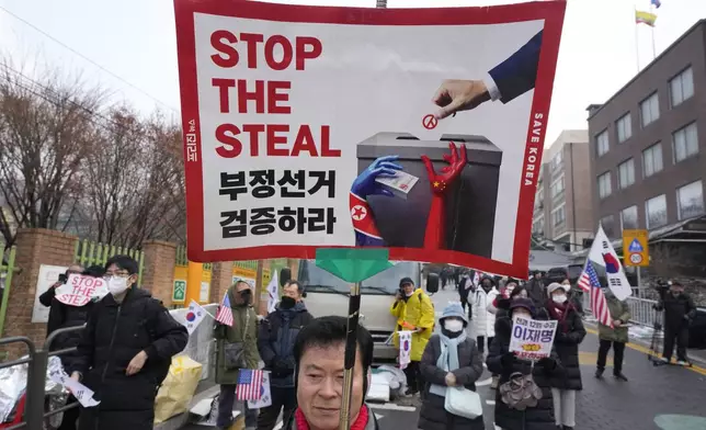 Supporters of impeached South Korean President Yoon Suk Yeol attend a rally to oppose his impeachment near the presidential residence in Seoul, South Korea, Monday, Jan. 6, 2025. (AP Photo/Ahn Young-joon)