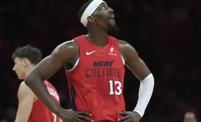 Miami Heat center Bam Adebayo (13) looks up at the scoreboard during the second half of an NBA basketball game against the Utah Jazz, Saturday, Jan. 4, 2025, in Miami. (AP Photo/Lynne Sladky)