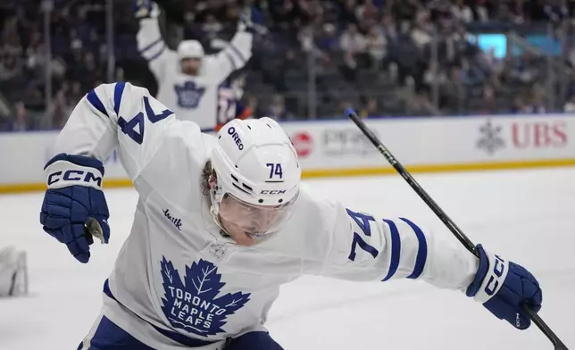 Toronto Maple Leafs' Bobby McMann (74) celebrates after scoring a goal during the third period of an NHL hockey game against the New York Islanders, Thursday, Jan. 2, 2025, in Elmont, N.Y. (AP Photo/Frank Franklin II)