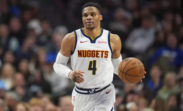Denver Nuggets guard Russell Westbrook dribbles up court during the second half of an NBA basketball game against the Dallas Mavericks, Sunday, Jan. 12, 2025, in Dallas. The Nuggets won 112-101. (AP Photo/Julio Cortez)