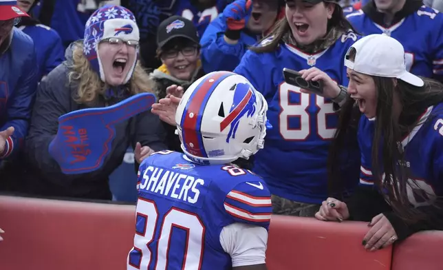 Buffalo Bills wide receiver Tyrell Shavers (80) celebrates with fans after scoring a touchdown against the New York Jets during the second half of an NFL football game, Sunday, Dec. 29, 2024, in Orchard Park, N.Y. (AP Photo/Gene J. Puskar)