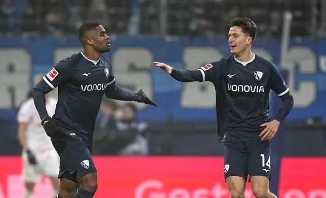 Bochum's Myron Boadu, left, celebrates with Bochum's Tim Oermann after scoring his side's opening goal during the German Bundesliga soccer match between VfL Bochum and RB Leipzig in Bochum, Germany, Saturday, Jan. 18, 2025. (AP Photo/Martin Meissner)
