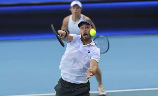 Laura Siegemund, rear, and Tim Puetz of Germany play Zhibek Kulambayeva and Dmitry Popko of Kazakhstan in their United Cup mixed doubles quarter final tennis match in Perth, Australia, Wednesday, Jan. 1, 2025. (AP Photo/Trevor Collens)