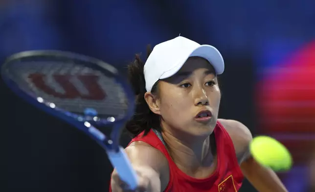 Shuai Zhang of China hits a return shot to Coco Gauff of the United States during their United Cup tennis match in Perth, Australia, Wednesday, Jan. 1, 2025. (AP Photo/Trevor Collens)