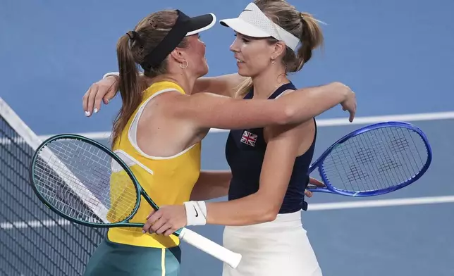 Britain's Katie Boulter is congratulated by Australia's Olivia Gadecki following their match at the United Cup tennis tournament in Sydney, Australia, Wednesday, Jan. 1, 2025. (AP Photo/Mark Baker)