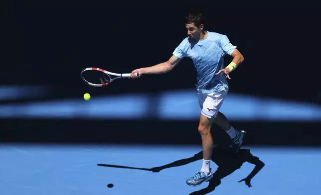 Alexander Shevchenko of Kazakhstan hits a return shot to Daniel Masur of Germany during their United Cup tennis match in Perth, Australia, Wednesday, Jan. 1, 2025. (AP Photo/Trevor Collens)