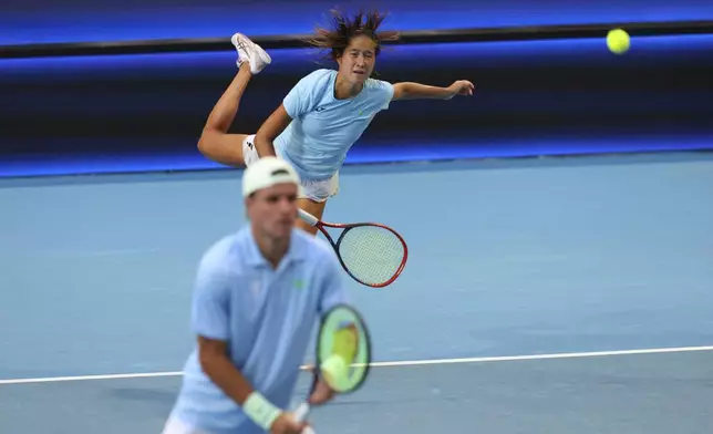 Zhibek Kulambayeva, top, and Dmitry Popko of Kazakhstan play Laura Siegemund and Tim Puetz of Germany in their United Cup quarter final mixed doubles tennis match in Perth, Australia, Wednesday, Jan. 1, 2025. (AP Photo/Trevor Collens)