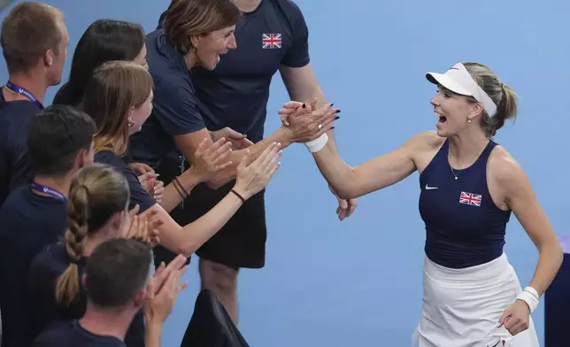 Britain's Katie Boulter is congratulated by teammates following her win over Australia's Olivia Gadecki during their match at the United Cup tennis tournament in Sydney, Australia, Wednesday, Jan. 1, 2025. (AP Photo/Mark Baker)