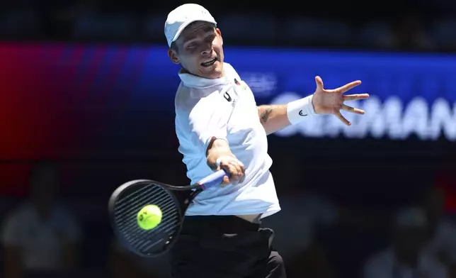 Daniel Masur of Germany hits a return to Alexander Shevchenko of Kazakhstan during their United Cup tennis match in Perth, Australia, Wednesday, Jan. 1, 2025. (AP Photo/Trevor Collens)