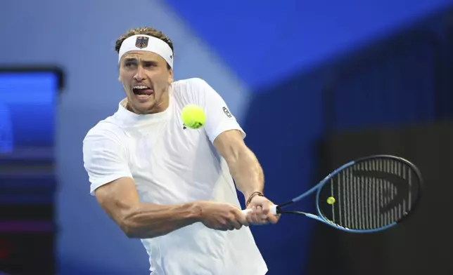 Alexander Zverev of Germany hits a return shot to Zhizhen Zhang of China during their United Cup tennis match in Perth, Australia, Monday, Dec. 30, 2024. (AP Photo/Trevor Collens)