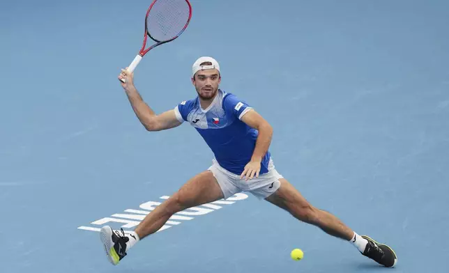 Czech Republic's Tomas Machac plays a forehand return to Poland's Hubert Hurkaz during their match at the United Cup tennis tournament in Sydney, Australia, Wednesday, Jan. 1, 2025. (AP Photo/Mark Baker)