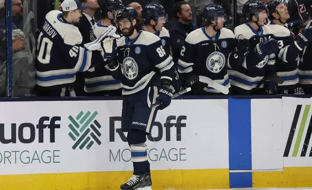 Columbus Blue Jackets' Kirill Marchenko celebrates his goal against the Carolina Hurricanes during the first period of an NHL hockey game Tuesday, Dec. 31, 2024, in Columbus, Ohio. (AP Photo/Jay LaPrete)