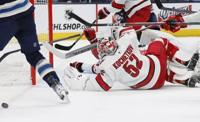 Carolina Hurricanes' Pyotr Kochetkov makes a save against the Columbus Blue Jackets' during the second period of an NHL hockey game, Tuesday, Dec. 31, 2024, in Columbus, Ohio. (AP Photo/Jay LaPrete)