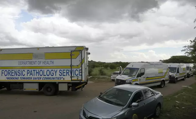 Forensic service vehicles arrive at the site where a rescue operation continues for miners trapped in an abandoned gold mine in Stilfontein, South Africa, Wednesday, Jan. 15, 2025. (AP Photo/Themba Hadebe)