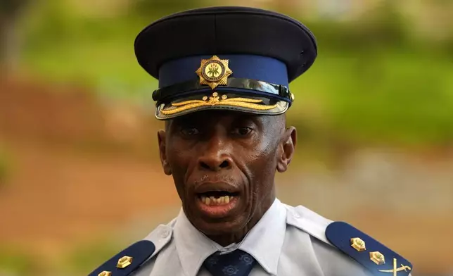The Acting Provincial Commissioner of North West, Major General Patrick Asaneng, speaks to journalists outside an abandoned gold mine, where miners are rescued from below ground, in Stilfontein, South Africa, Wednesday, Jan. 15, 2025. (AP Photo/Themba Hadebe)