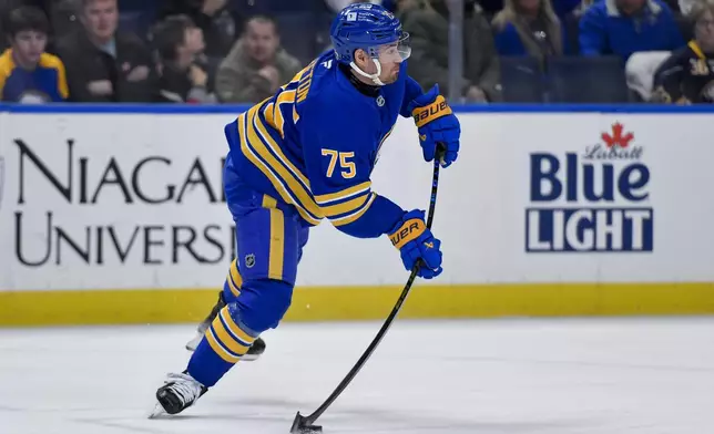 Buffalo Sabres defenseman Connor Clifton passes the puck during the first period of an NHL hockey game against the Carolina Hurricanes in Buffalo, N.Y., Wednesday, Jan. 15, 2025. (AP Photo/Adrian Kraus)