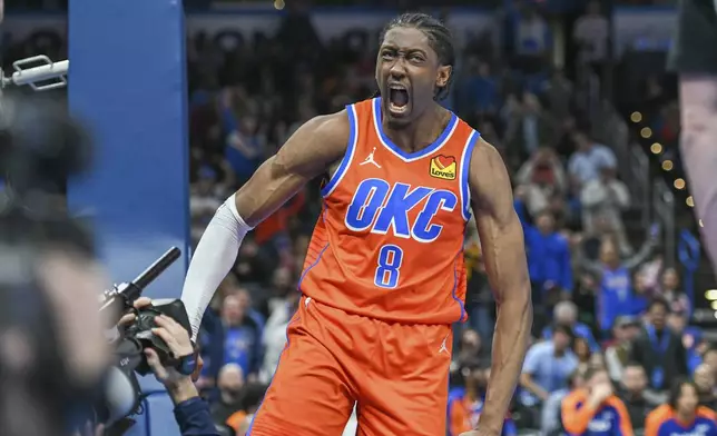 Oklahoma City Thunder forward Jalen Williams celebrates a dunk during the second half of an NBA basketball game agains thte New York Knicks, Friday, Jan 3, 2025, in Oklahoma City. (AP Photo/Kyle Phillips)