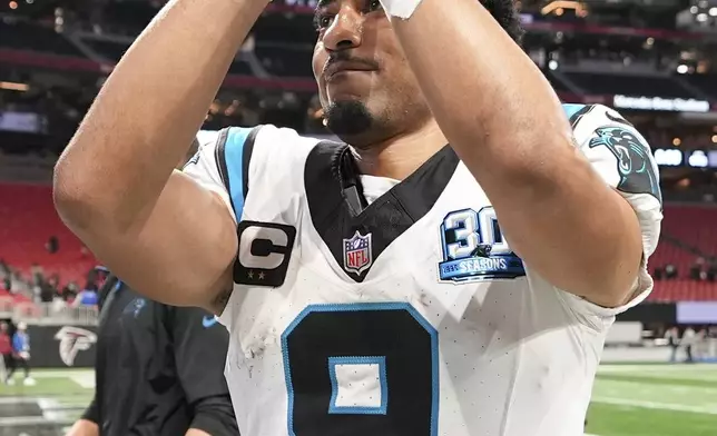 Carolina Panthers quarterback Bryce Young celebrates after their Winn during overtime in an NFL football game against the Atlanta Falcons, Sunday, Jan. 5, 2025, in Atlanta. (AP Photo/Brynn Anderson)